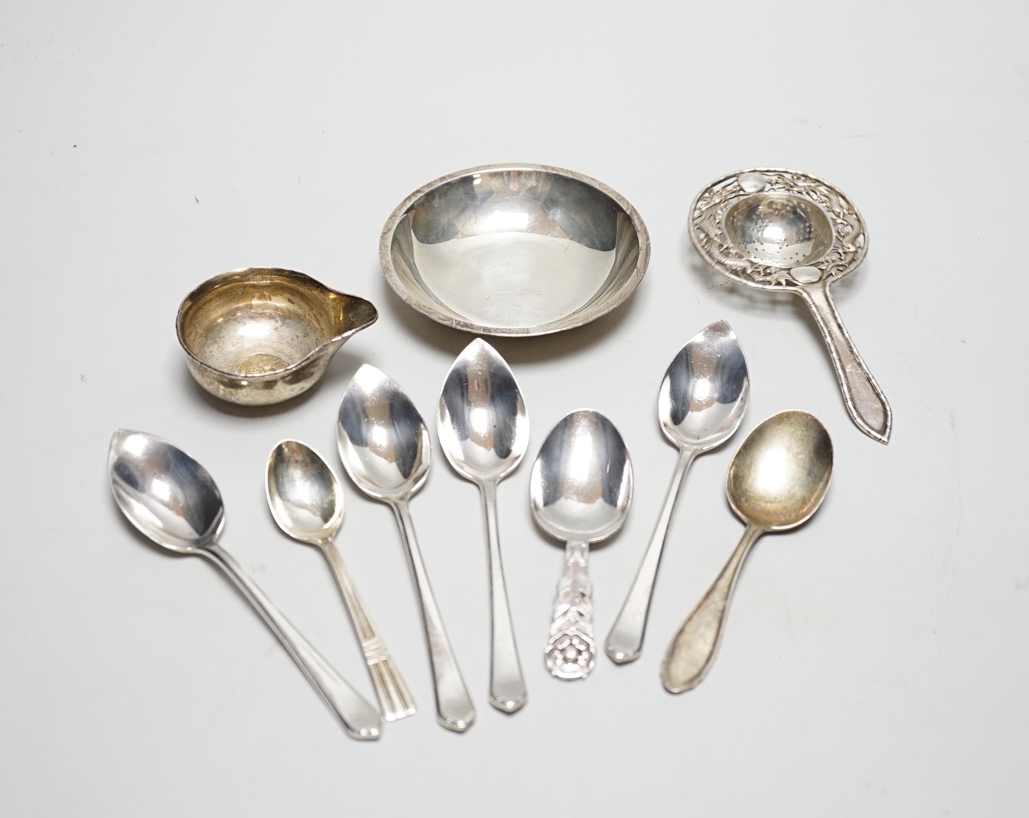 An Elizabeth II silver spoon by Robert Edgar Stone, London, 1957, 10.1cm and sundry silver flatware etc.